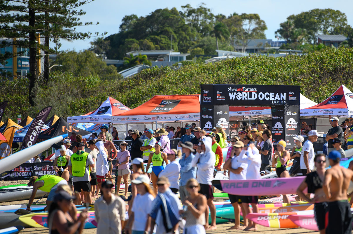 Crowds and competitors gathered beneath the Shaw and Partners World Ocean Series arch at Alexandra Headland